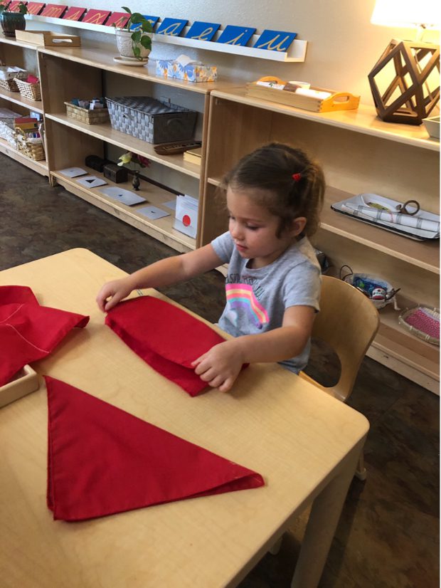 Early Childhood Practical Life Folding, The Montessori Academy of Arlington, Private School Arlington TX
